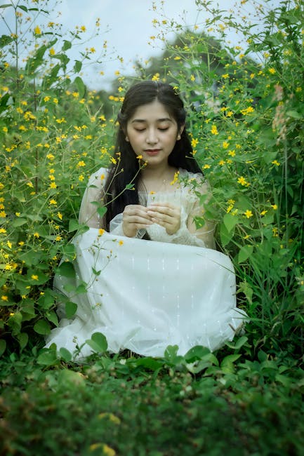 A person stretching gently outdoors surrounded by nature.